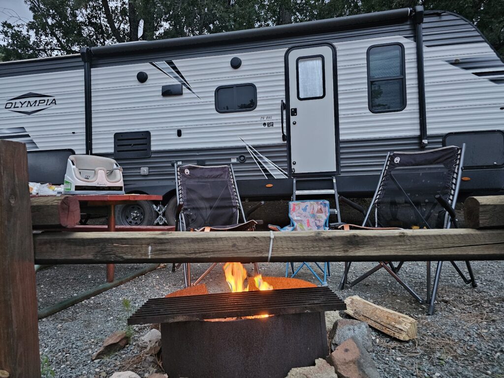 Our chairs, trailer, and campfire at Bonito Hollow RV Park.